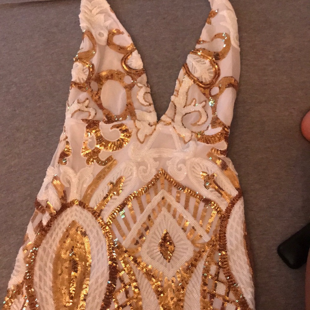 Backless white and gold dress